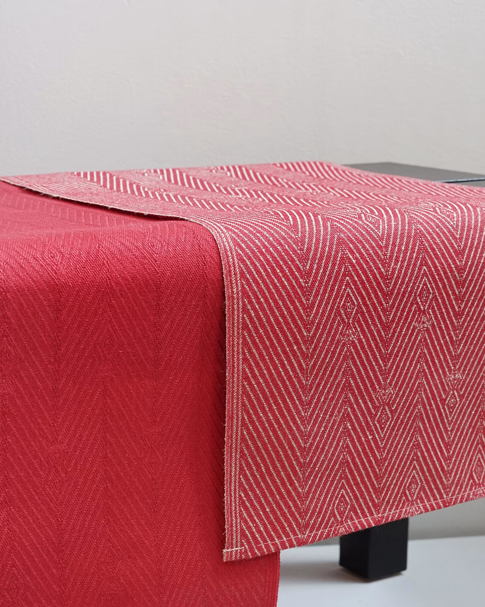 single-cover-image-2-linfro-red runner hanging over a pallet