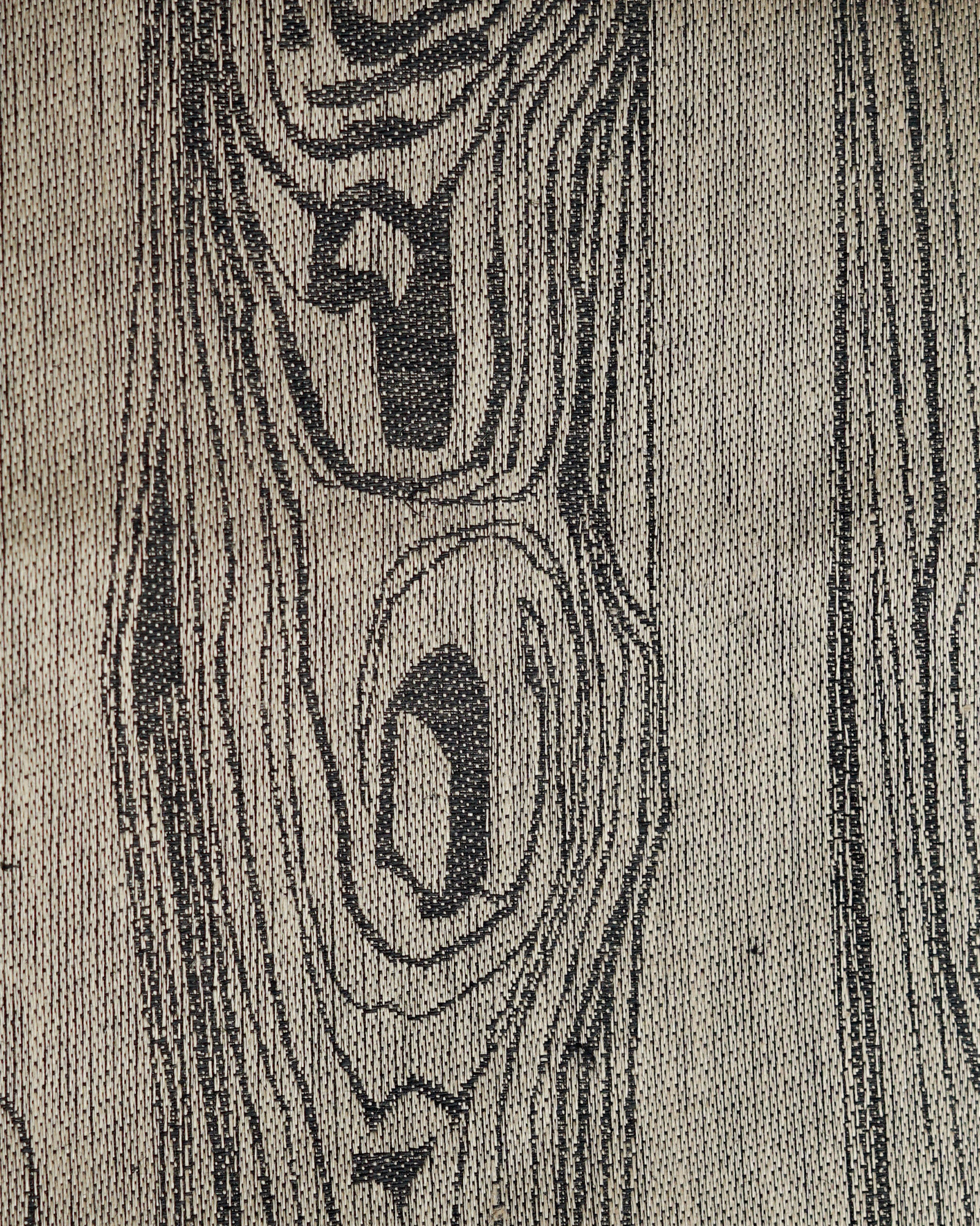 Närbild på Tilja sjumilaskog svart/sand. Hanna Bredberg. Klässbolslinneväveri